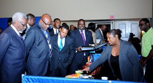 Delegates touring the exhibition following the Opening Ceremony of the Ninth Comprehensive Disaster Management Conference, at Melia Nassau Beach Resort, November 30.  From left: The Most Hon. P J Patterson, former Prime Minister of Jamaica; The Hon. Adriel Brathwaite, Chairman, CDEMA Council; and the Hon Arnold Forbes, Minister of State, Ministry of Works and Urban Development (at centre).  (BIS Photo/Kemuel Stubbs)