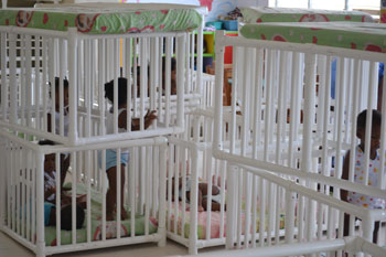 Infants at the Day Nursery are safely secured by placing cribs on top of each other and covered with mattresses