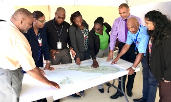 Members of the 4 regional agencies and representatives from National Disaster Offices getting ready for the exercise (from left to right: Philmore Mullin (NDC, Antigua & Barbuda); Lorraine Francis (CARPHA), Mandela Christian (CDEMA), Nadine Bushell (CARICOM IMPACS), Claricia Stephens (NDC, St. Kitts & Nevis), Captain Brian Roberts (RSS), BG General (R) Earl Arthurs (CDEMA) and Joanne Persad (CDEMA).  