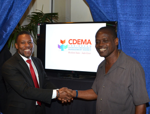 Unveiling of the new CDEMA logo by the Deputy Prime Minister of Grenada, Carriacou and Petite Martinique and Minister of Legal Affairs, Labour, Carriacou and Petite Martinique Affairs & Local Government, the Hon, Elvin Nimrod and Executive Director of CDEMA, Mr. Ronald Jackson.