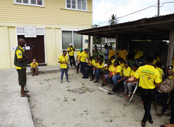 CDC Staff and Volunteers being briefed by Major Kester Craig, Operations/Training Officer CDC at the conclusion of the Community Registration Drive in Klien Pouderoyen