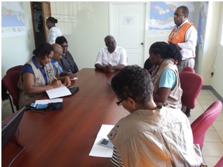 Members of the COST meeting with Minister Francois Anick Joseph and Madame Jean Baptiste, Director of the CPD.