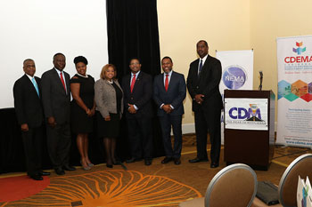 L-R: Ambassador Joshua Sears, Senior Policy Advisor, Office of the Prime Minister, Government of The Bahamas; Mr Simon Wilson, Financial Secretary, Ministry of Finance, Government of The Bahamas; Ms Maria Corbin, Executive Assistant, CDEMA; Ms Tanya Woodside, Area Coordinator and Membership Chair, Rotary Clubs of The Bahamas; Hon. Peter Turnquest, Deputy Prime Minister and Minister of Finance, Government of The Bahamas; Mr Ronald Jackson, Executive Director, CDEMA and Captain Stephen Russell, Director, NEMA, Government of The Bahamas. 