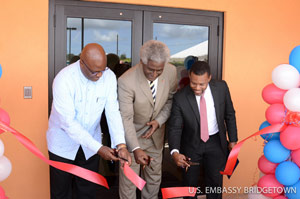 The Honorable Dr. Larry Palmer, United States Ambassador to Barbados, the Eastern Caribbean, and the OECS; the Honorable Adriel Brathwaite, Attorney General and Minister of Home Affairs of Barbados; and Mr. Ronald Jackson, Executive Director of CDEMA partake in a ribbon-cutting ceremony to inaugurate CDEMA’s new regional facility The Honorable Dr. Larry Palmer, United States Ambassador to Barbados, the Eastern Caribbean, and the OECS; the Honorable Adriel Brathwaite, Attorney General and Minister of Home Affairs of Barbados; and Mr. Ronald Jackson, Executive Director of CDEMA partake in a ribbon-cutting ceremony to inaugurate CDEMA’s new regional facility
