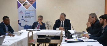 White Helmets Delegation listens attentively to Ronald Jackson, Executive Director CDEMA.  Delegation (l-r) Ambassador Limeres Diego, Argentine Embassy, Barbados, Ambassador Gabriel Ive, President of White Helmets Commission, Mr. Alfredo Ladillinsky, Project Coordinator of WHC and Mr. Guillerao Prol, General Directorate of South-South Cooperation