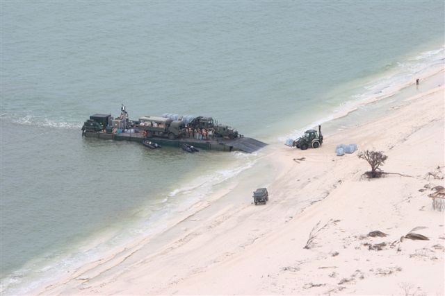 Military equipment, supplies & personnel from the Royal Engineers, Royal Marines and Royal Logistics Corps being taken ashore by mexeflote at Crooked Island (Credit: Crown Copyright)